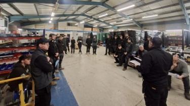 Workshop team and their Friday morning tool talk 